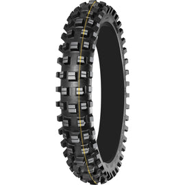 A black motorcycle tyre with a yellow stripe, designed for off-road use with a deep, aggressive knob pattern.